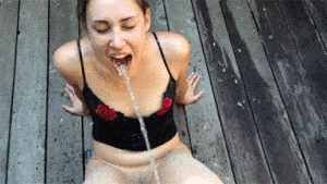 Mature lesbian drinks pee from four young women.