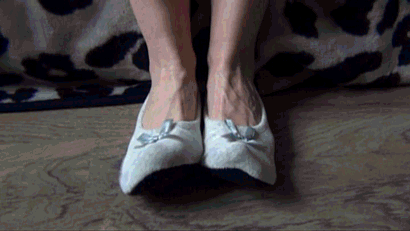 Beige flats blue toenails dangling feet
