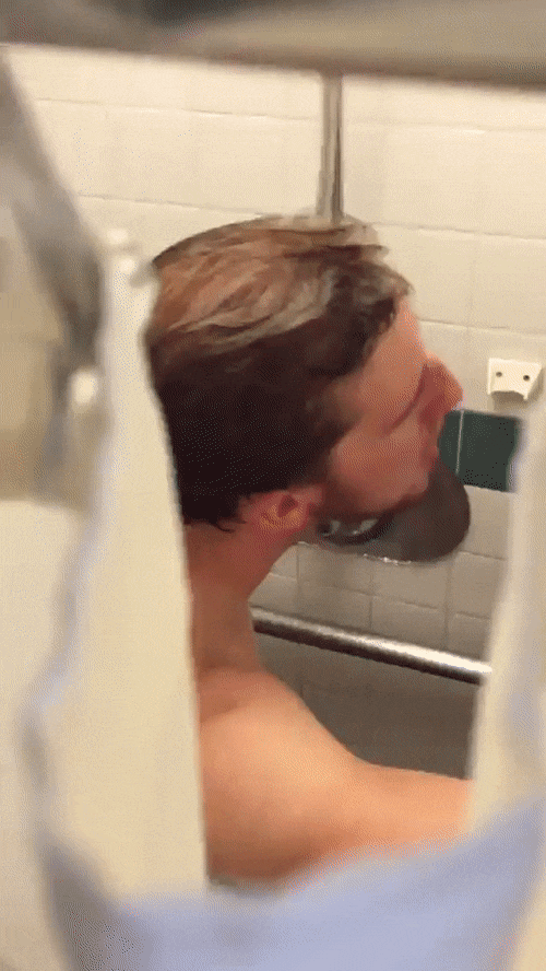 Girl spying man the shower